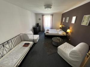 Postel nebo postele na pokoji v ubytování hotel Florian Sedlčany