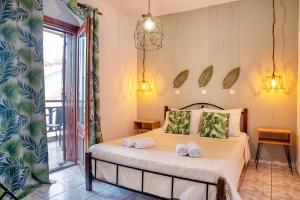 Postel nebo postele na pokoji v ubytování Ostria Hotel