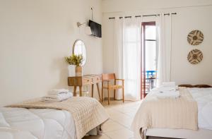 Posteľ alebo postele v izbe v ubytovaní Blue House Apartments