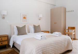 Posteľ alebo postele v izbe v ubytovaní Blue House Apartments