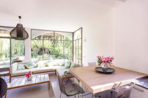 a living room with a table and a couch at Lesa villa near the lakeside in Lesa