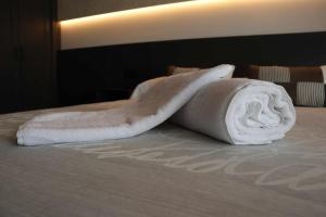 Łóżko lub łóżka w pokoju w obiekcie La Aduana - The Lodging Experience