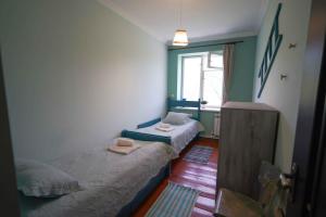 a room with two beds and a window at Chamich Guesthouse in Debed