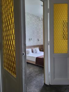 Posteľ alebo postele v izbe v ubytovaní Hotel Maximum