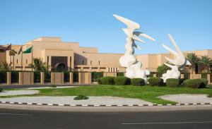 a statue of two birds in front of a building at Park Hyatt Jeddah - Marina, Club and Spa in Jeddah
