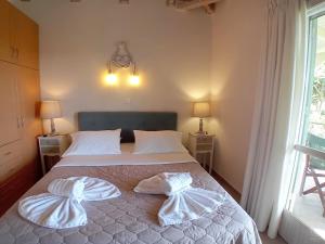 Postel nebo postele na pokoji v ubytování Muses Villas