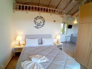 Postel nebo postele na pokoji v ubytování Muses Villas