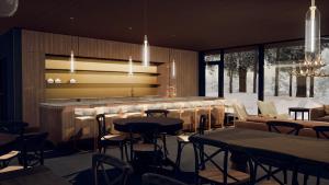 um restaurante com mesas e cadeiras e um bar em Levi OloResort em Levi