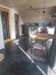 a kitchen with a table and a table at 1 Zimmer Appartement mit Bad in Königsbrunn