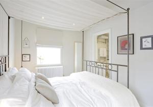 En eller flere senge i et værelse på Interludes