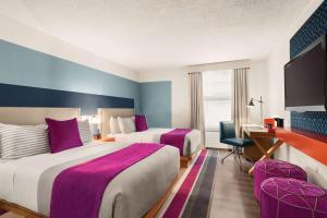 Ein Bett oder Betten in einem Zimmer der Unterkunft TRYP by Wyndham Isla Verde