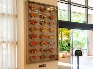a wall with a display of food items at Grand Mercure SP Itaim Bibi in Sao Paulo