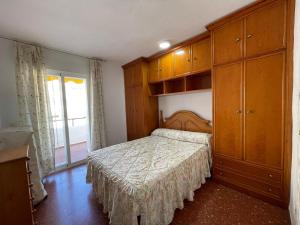 Postel nebo postele na pokoji v ubytování TERRASOL PIRAMIDES 1 DORMITORIO CALETA DE VELEZ