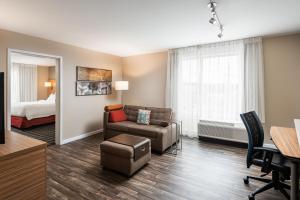 a living room with a couch and a bed at TownePlace Suites by Marriott Cleveland in Cleveland +25 photos