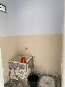 Vannituba majutusasutuses TERAS DAMAI HOMESTAY