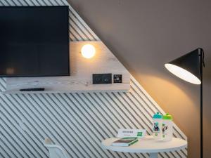 TV a/nebo společenská místnost v ubytování ibis Styles Porto Vecchio