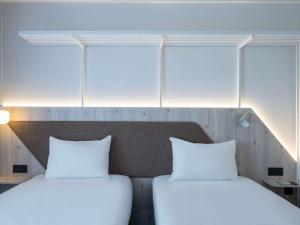 Postel nebo postele na pokoji v ubytování ibis Styles Porto Vecchio