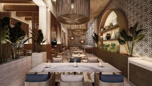 Miches的住宿－Zemi Miches All-Inclusive Resort, Curio Collection By Hilton，餐厅配有木桌和椅子