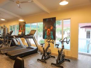a gym with treadmills and elliptical machines at Le Kree Downtown Hotel in Phnom Penh