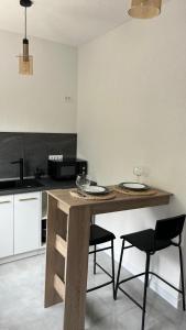 Kuchyňa alebo kuchynka v ubytovaní Apartmani MM