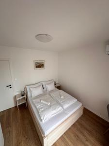 Katil atau katil-katil dalam bilik di Apartman Opatija
