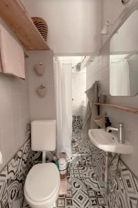 a bathroom with a toilet and a sink at Apartment_Lucas in Hamburg