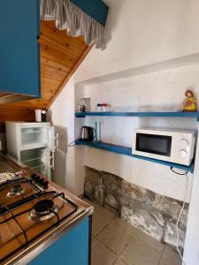 A kitchen or kitchenette at Appartamenti Vanacore