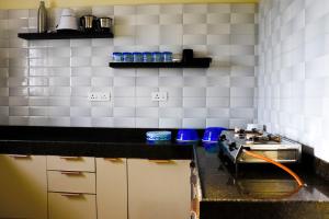 Kjøkken eller kjøkkenkrok på Sree Kailas Apartment