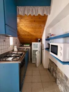 A kitchen or kitchenette at Appartamenti Vanacore