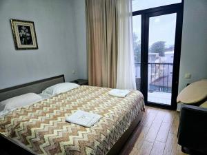 Letto o letti in una camera di IVERIA BEACH
