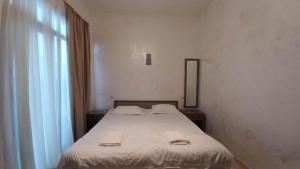 Letto o letti in una camera di IVERIA BEACH