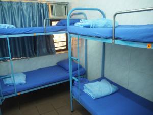 Un pat sau paturi într-o cameră la Kung-fu Hostel 功夫旅舍