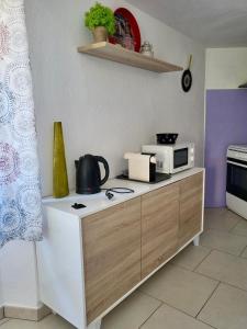 A kitchen or kitchenette at Appartamenti Vanacore