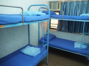 Un pat sau paturi într-o cameră la Kung-fu Hostel 功夫旅舍