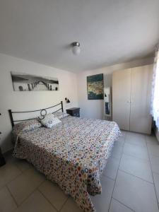 A bed or beds in a room at Appartamenti Vanacore