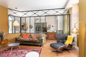 a living room with a couch and two chairs at Les Gargouilles - House with crazy charm heated pool and garden in Caluire-et-Cuire +33 photos