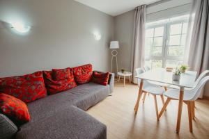 a living room with a couch and a table at LAR DA REVOLTA in Cedeira