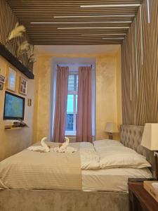 Postel nebo postele na pokoji v ubytování Urban Boutique Hotel
