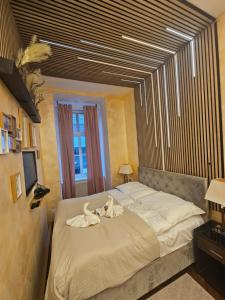 Postel nebo postele na pokoji v ubytování Urban Boutique Hotel