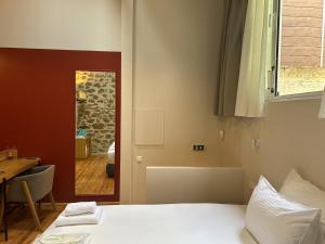 Ένα ή περισσότερα κρεβάτια σε δωμάτιο στο Belle Athenes - Luxury Rooms at Monastiraki Railway Station