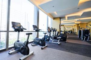 a gym with a bunch of cardio equipment in a building at JW Marriott Hotel Taiyuan in Taiyuan