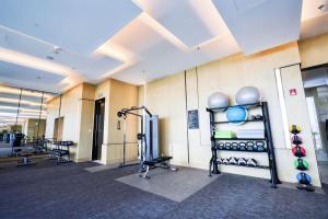a gym with cardio equipment in a building at JW Marriott Hotel Taiyuan in Taiyuan