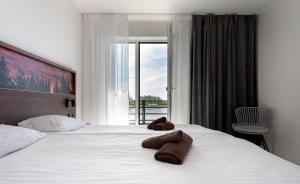 Postel nebo postele na pokoji v ubytování Ö Seaside Suites & SPA