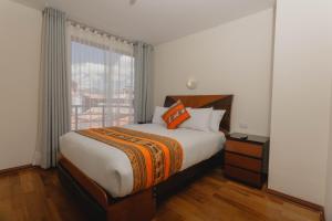 Llit o llits en una habitació de Quechua ApartHotel
