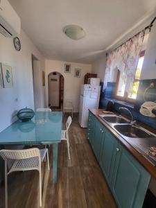 A kitchen or kitchenette at Appartamenti Vanacore