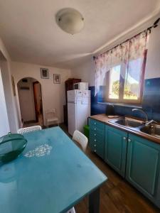 A kitchen or kitchenette at Appartamenti Vanacore