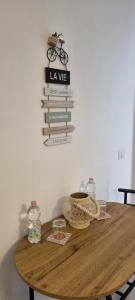a wooden table with a stack of books on a wall at Suite Arianna in Cannobio