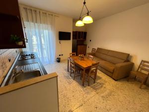 a living room with a couch and a table at Sweet Home Capodimonte in Naples