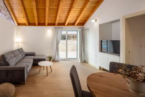 a living room with a couch and a table at Villa Casa di Perla in Primošten