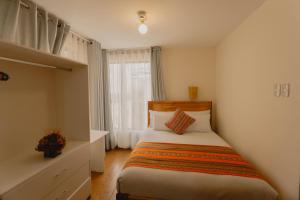 Llit o llits en una habitació de Quechua ApartHotel